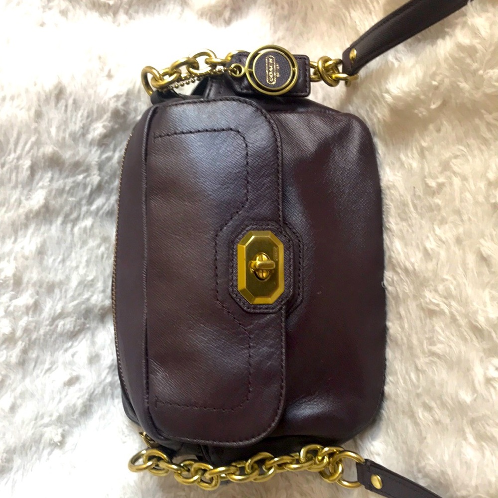 BNWT. COACH PURSE! Never used-too small for me. This is an eggplant color.